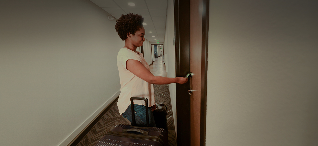 Woman checking into a hotel