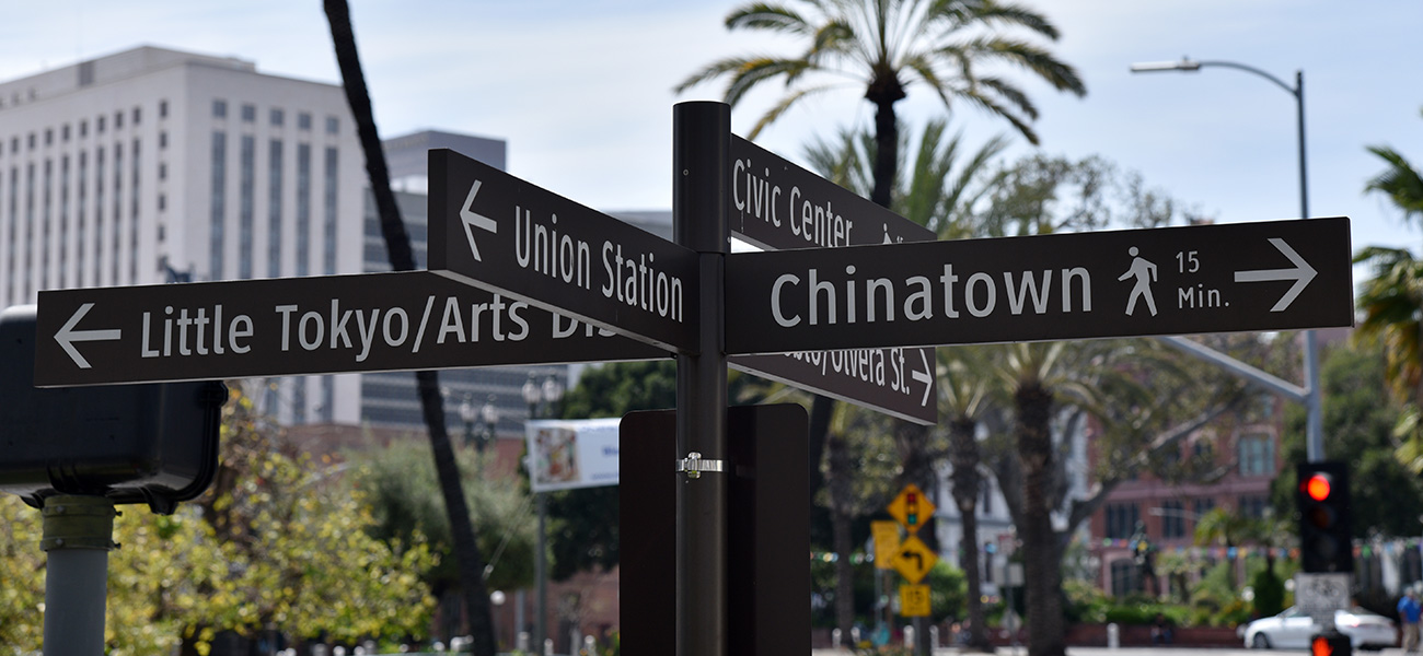 Street signs showing Union Station, Olvera Street and Chinatown.